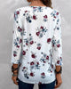 Elegante Bluse mit floralen Druckknöpfen