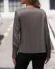 Unifarbene Bluse mit Falten